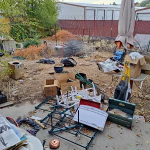 piles of junk outside a house